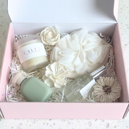 subscription box of skincare products and flowers in a decorative box with Cali Love branding