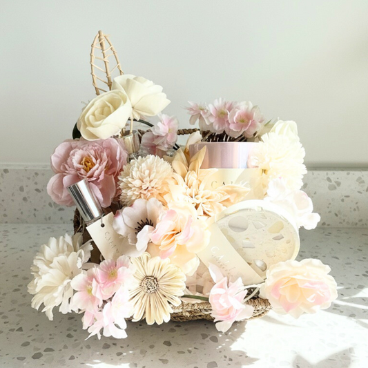 Decorative arrangement with flowers with self-care products on a terrazzo counter