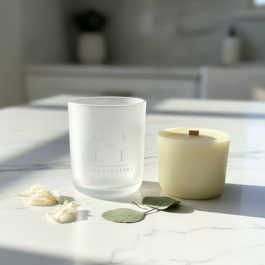 cali dream candle refill styled on marble service with dried flowers around it.